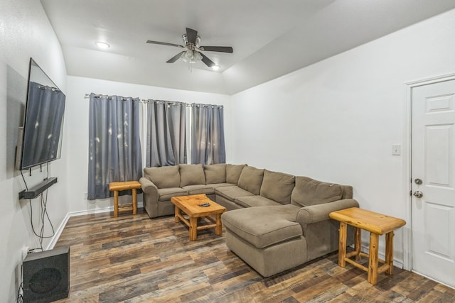 living room with ceiling fan and dark hardwood / wood-style floors