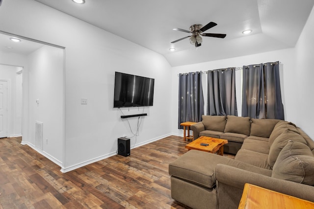 living room featuring ceiling fan, lofted ceiling, and dark hardwood / wood-style flooring