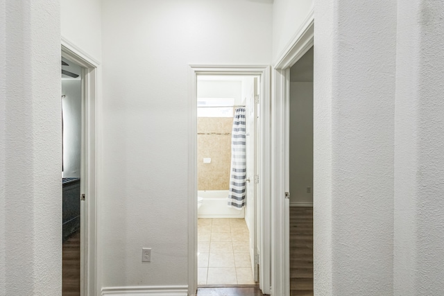 corridor with tile patterned floors