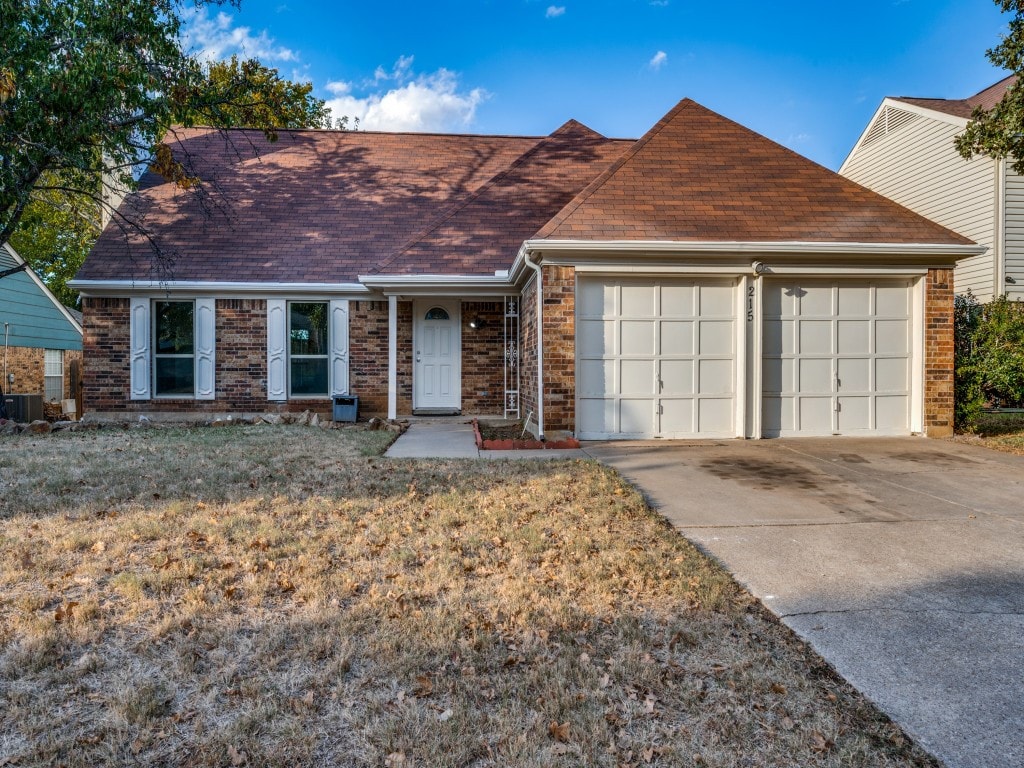 ranch-style house with a front lawn and a garage