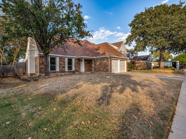 view of front facade with a front yard and a garage