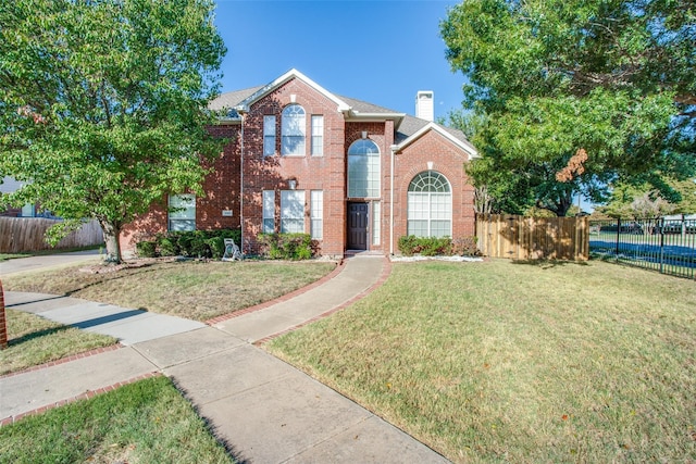 front facade with a front yard