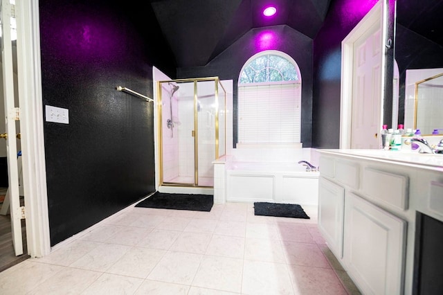 bathroom featuring vanity, plus walk in shower, tile patterned floors, and vaulted ceiling