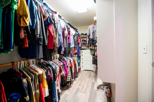 walk in closet featuring light hardwood / wood-style floors