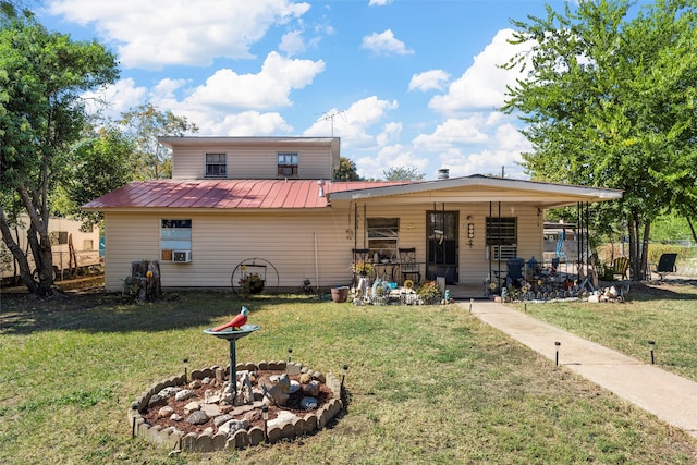 view of front of house featuring a front yard and a fire pit