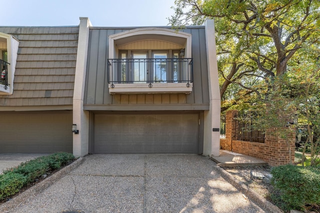 exterior space featuring a balcony and a garage