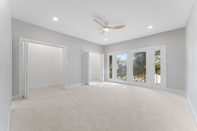 carpeted empty room with ceiling fan