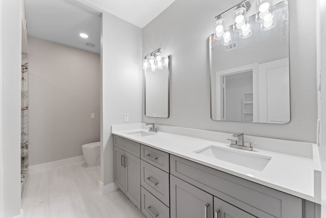 bathroom with vanity and toilet