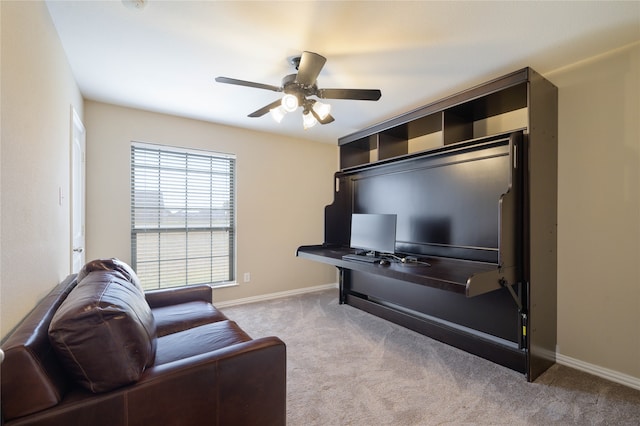 carpeted home office with ceiling fan