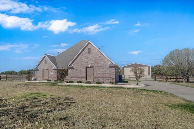 view of front facade with a front yard and a garage