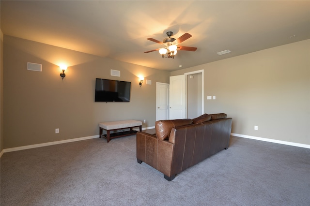 carpeted living room with ceiling fan