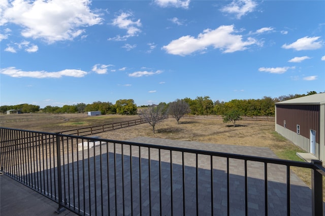 balcony featuring a rural view