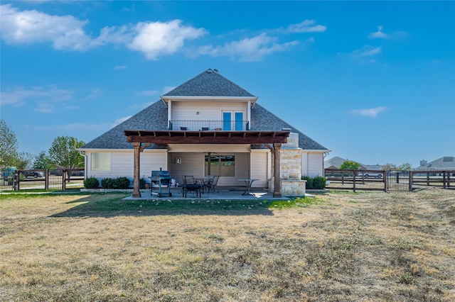 back of property with a yard, a patio, and a pergola