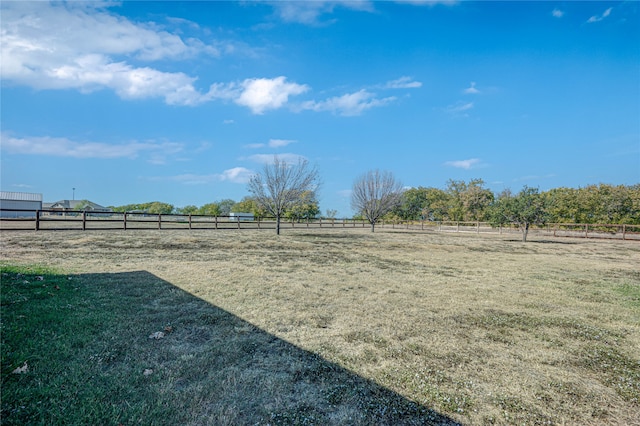 view of yard with a rural view