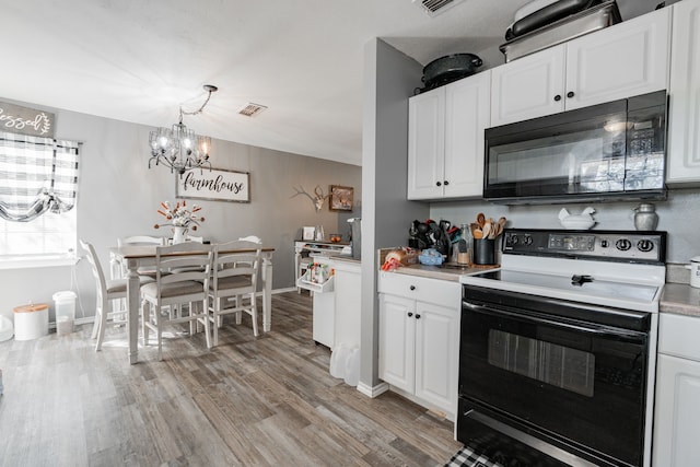 kitchen with an inviting chandelier, white electric range, light wood-type flooring, and white cabinetry