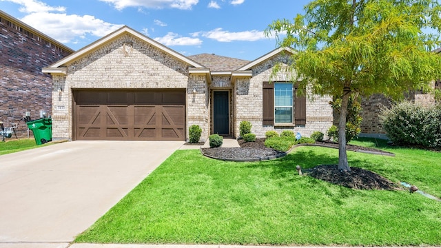 view of front facade with a front yard and a garage