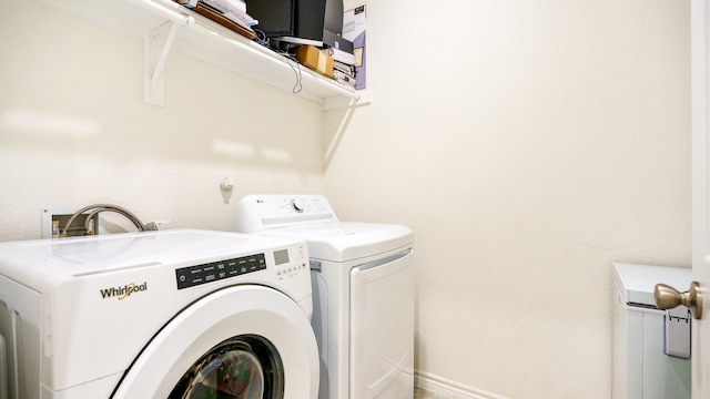 laundry room featuring separate washer and dryer