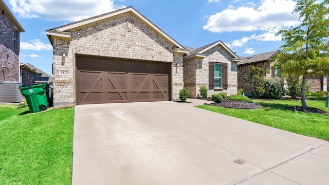 view of front of property with a front yard and a garage