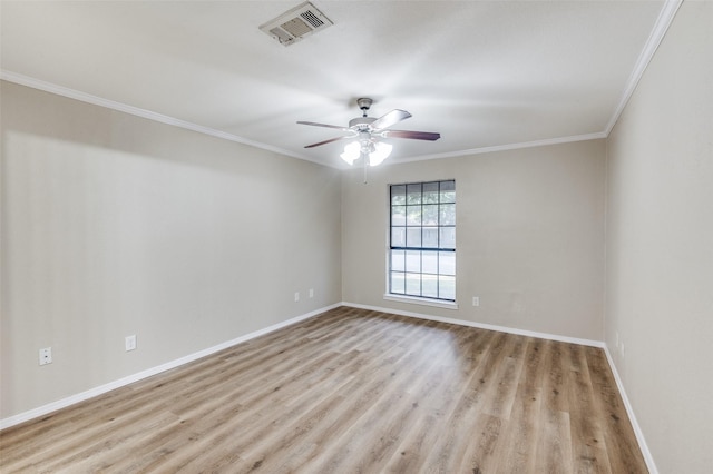 unfurnished room featuring crown molding, ceiling fan, and light wood-type flooring