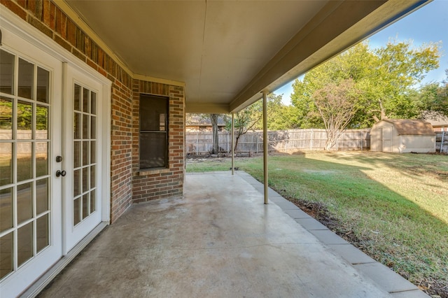 view of patio / terrace with a shed