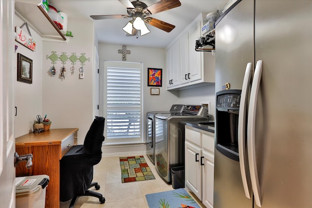 washroom with ceiling fan, washer and dryer, light tile patterned floors, and cabinets