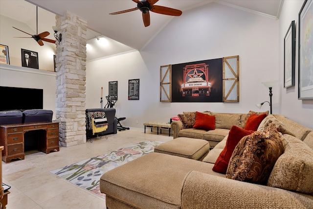 tiled living room featuring rail lighting, ceiling fan, high vaulted ceiling, ornamental molding, and ornate columns