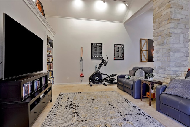 living room with crown molding, lofted ceiling, and built in features