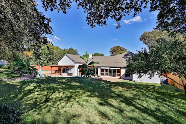 exterior space with a patio area and a lawn