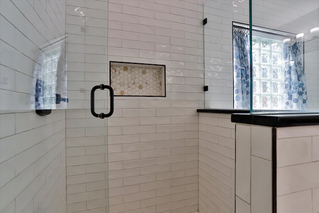 bathroom with an enclosed shower