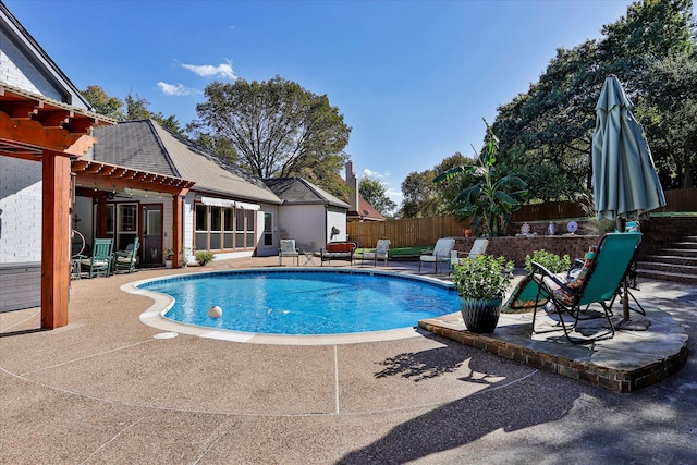 view of pool featuring a patio