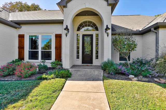 entrance to property with a yard