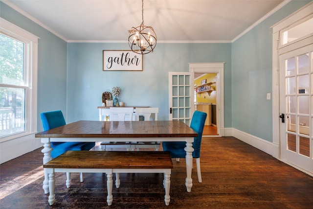 dining area with a notable chandelier, ornamental molding, and dark hardwood / wood-style flooring