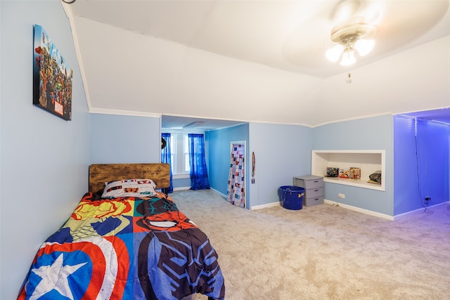 bedroom with ornamental molding, carpet, vaulted ceiling, and ceiling fan