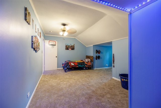 bedroom featuring ornamental molding, carpet flooring, vaulted ceiling, and ceiling fan