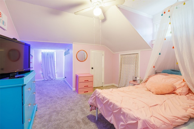 bedroom with vaulted ceiling, light carpet, and ceiling fan