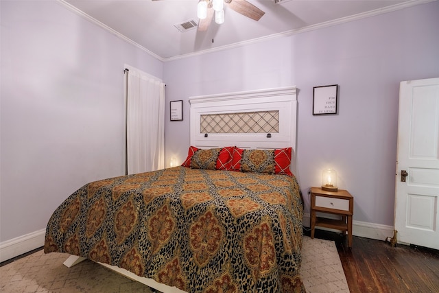 bedroom with dark wood-type flooring, ceiling fan, and ornamental molding