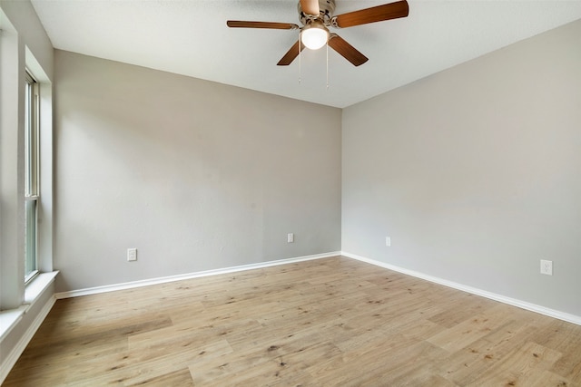 spare room with light hardwood / wood-style flooring and ceiling fan