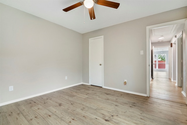 spare room with light hardwood / wood-style flooring and ceiling fan