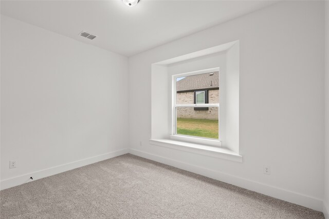 empty room with carpet flooring