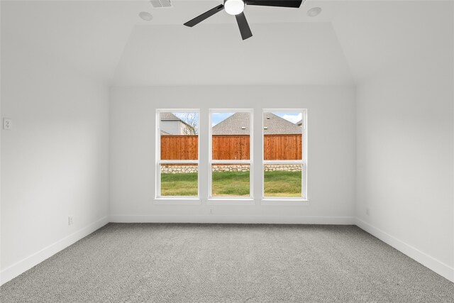 spare room with lofted ceiling, carpet floors, and ceiling fan