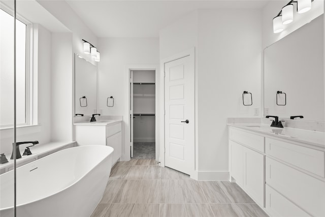 bathroom with vanity and a bathing tub