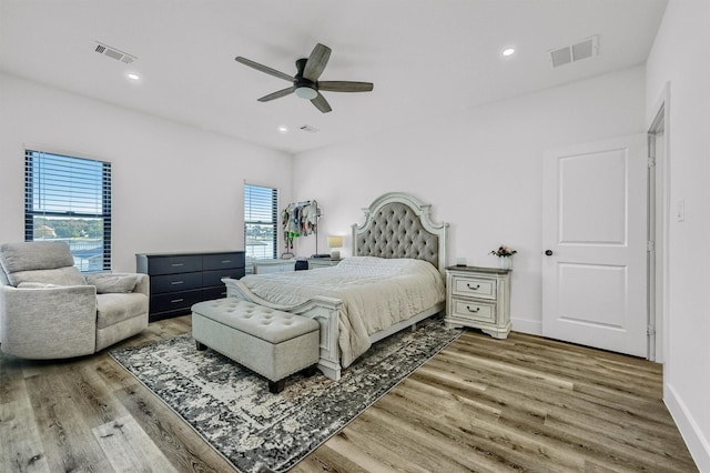 827 Kiowa Dr W, Gainesville, TX 76240 - bedroom featuring wood finished floors, multiple windows, ceiling fan, and recessed lighting