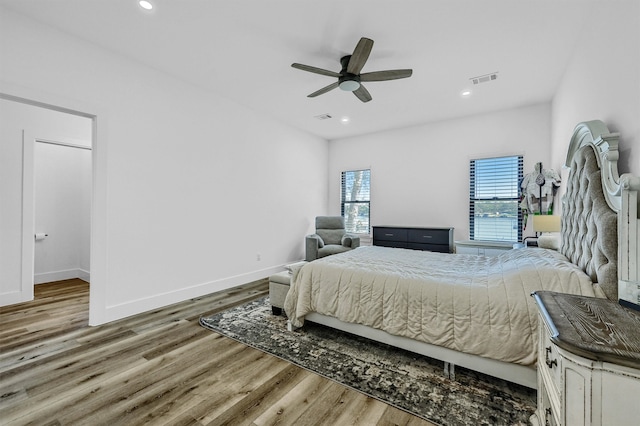 bedroom featuring light hardwood / wood-style flooring and ceiling fan