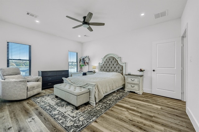 bedroom featuring wood-type flooring and ceiling fan