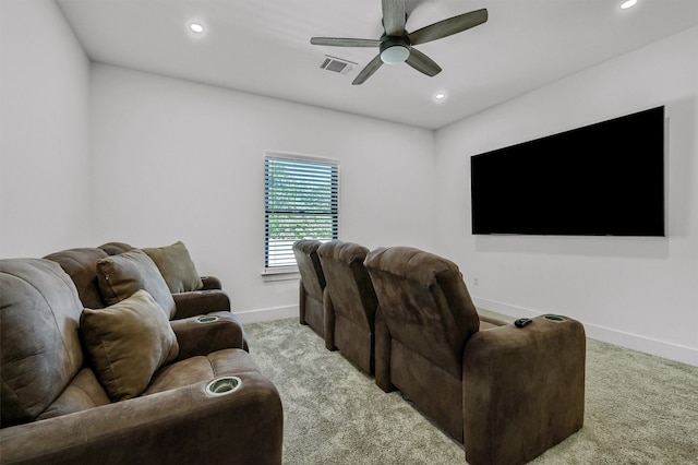 home theater with light colored carpet and ceiling fan