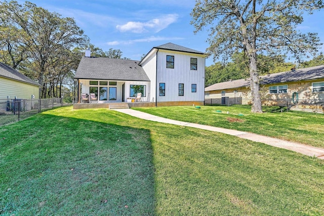 827 Kiowa Dr W, Gainesville, TX 76240 - rear view of property with board and batten siding, a chimney, and roof with shingles