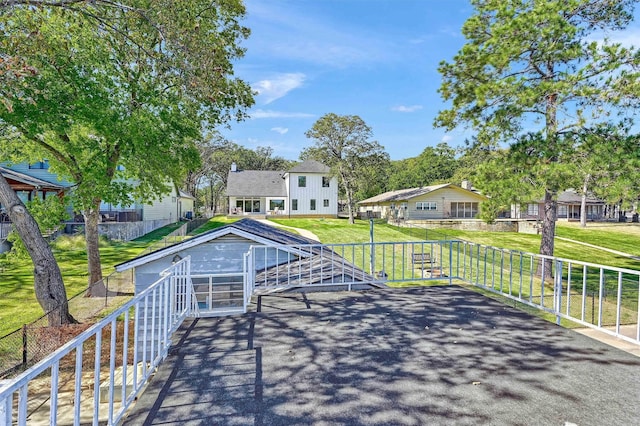 827 Kiowa Dr W, Gainesville, TX 76240 - wooden deck with a residential view and a yard