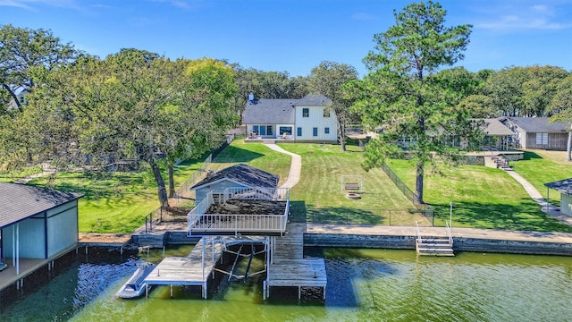 827 Kiowa Dr W, Gainesville, TX 76240 - dock with a water view and a fenced backyard