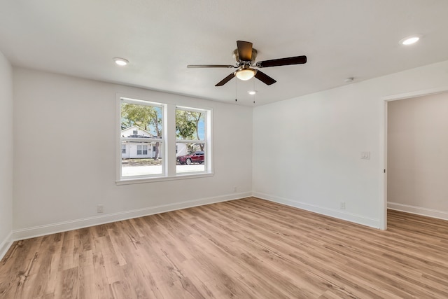 unfurnished room featuring light wood-type flooring and ceiling fan