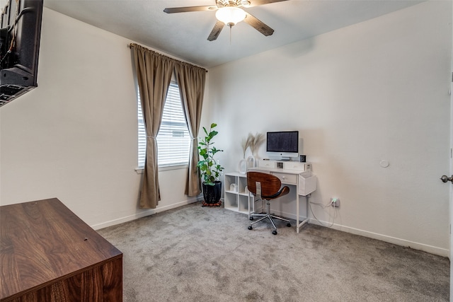 carpeted office featuring ceiling fan